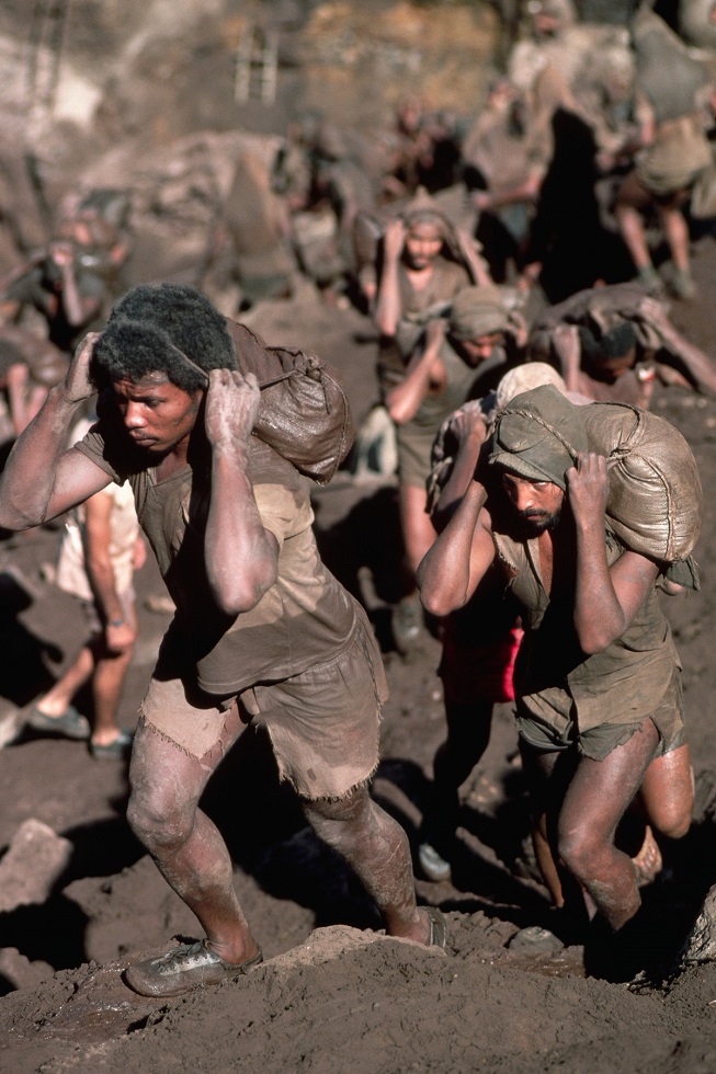 Gold Miners Carry Bags of Dirt