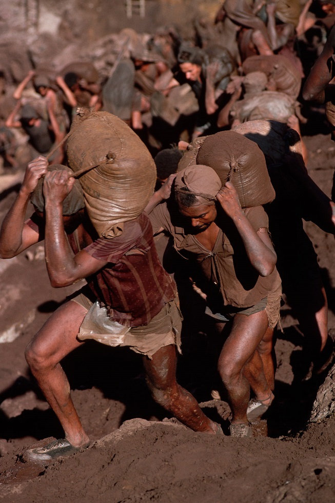Gold Miners Carry Bags of Dirt
